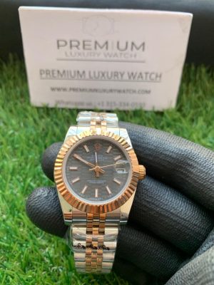 rolex lady dateUniversity 31mm two tone rose gold black dial oyster perpetual jubilee bracelet watch