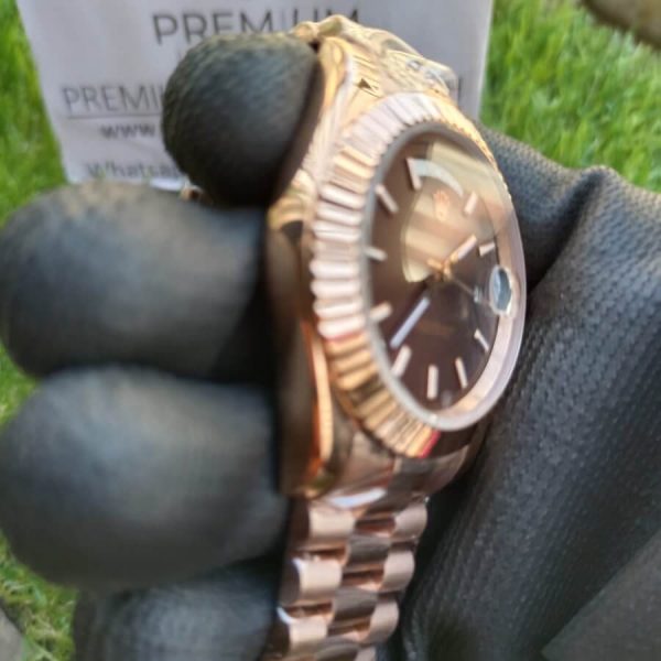 2 rolex everose gold daydate 40 watch fluted bezel chocolate diagonal motif index dial president bracelet
