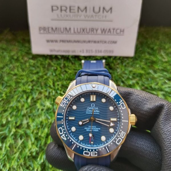 2 omega seamaster 300m coaxial master chronometer ceramic blue gold dial on rubber strap automatic mens watch