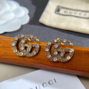 6 logo stud earrings gold for women 2799