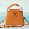 louis vuitton capucines mini taurillon jaune sunbeam for women womens handbags shoulder and crossbody bags 21cm83in lv buzzbify 1